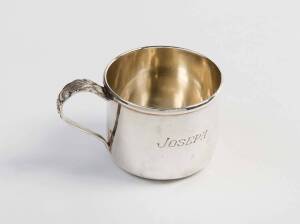 A sterling silver cup with makers mark RLB 551, engraved "Joseph", 4cm high and a tea caddy spoon from "Cliff House, San Francisco" by Robert Wallace & Sons. A gift to the Heifetz family on the birth of their son. (2 items)