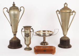 Collection of cycling trophies from the 1930s predominantly won by "R.Goodwin". Nice art deco style in particular (2) handsome covered cups measuring 52cm each. Also includes a silky oak box with silver presentation plaque. Good condition