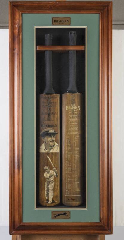 DON BRADMAN, display "The Bradman Record 1927-1949", comprising two full size Cricket Bats, one with two painted portraits by Dave Thomas; other printed on front with Bradman’s playing statistics, with original signature at the bottom of the bat. Mounted