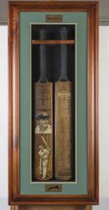 DON BRADMAN, display "The Bradman Record 1927-1949", comprising two full size Cricket Bats, one with two painted portraits by Dave Thomas; other printed on front with Bradman’s playing statistics, with original signature at the bottom of the bat. Mounted 
