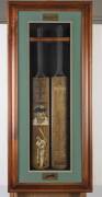 DON BRADMAN, display "The Bradman Record 1927-1949", comprising two full size Cricket Bats, one with two painted portraits by Dave Thomas; other printed on front with Bradman’s playing statistics, with original signature at the bottom of the bat. Mounted