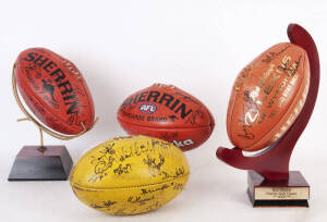 SIGNED FOOTBALLS: Group including footballs signed by Collingwood, Footscray, Bob Shearer Golf Day; Adelaide with facsimile autographs; also two display stands. Fair/Good condition.