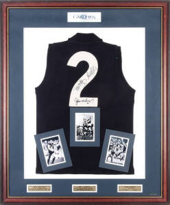 CARLTON: "Number 2 Jumper" display comprising Carlton jumper signed on the number by John Nicholls, Peter Motley & Greg Williams, limited edition 113/222, window mounted with action photo of each player, framed & glazed, overall 89x109cm. With CoA.