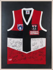 ST.KILDA: c1997 St.Kilda football jumper with 30 signatures, noted Robert Harvey, Nathan Burke & Stewart Loewe, framed & glazed, overall 71x94cm.