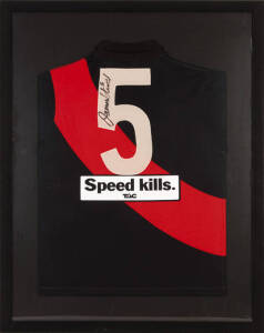 JAMES HIRD (Essendon), display comprising signed Essendon jumper, window mounted, framed & glazed, overall 78x98cm.