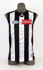 COLLINGWOOD: Collingwood Football Jumper signed by members of 2013 team, 34 signatures including Dane Swan, Harry O'Brien, Steele Sidebottom & Nick Maxwell.