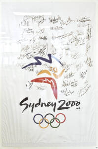 SYDNEY 2000 FLAG/PENNANT, with 42 signatures including Susie O'Neill, Andrew Hoy & James Tomkins, framed & glazed, overall 107x162cm.