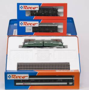 MODEL RAILWAYS: ROCO: E.646/E.645 Electric Locomotive (03100), with Rolling Stock Comprising of SBB 2nd Class Passenger Car (44472), P.ST.E.V 1st & 2nd Class Passenger Car (45410), DR 2nd Class Passenger Car (44585). All mint in original cardboard packagi