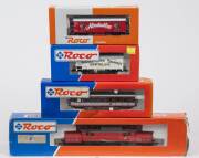 MODEL RAILWAYS: ROCO: OBB BR 1020 Electric Locomotive (43485), with Rolling Stock Comprising of OBB 2nd Class Passenger Car (34008), CSD Bratislava Pivovar Stein Brauerei Beer Car (48034), OBB &lsquo;Almdudler&rsquo; Refrigerated Freight Car (44585). All mint in orig