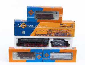 MODEL RAILWAYS: ROCO: DB Steam Locomotive BR 01 (04119B), with Rolling Stock Comprising of FS Telescopic Hood Car (4395G), OBB Covered Freight Car (4305F), DB Open Coal Freight Car (4309S). All mint in original cardboard packaging. (4 items)