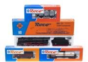 MODEL RAILWAYS: ROCO: DR BR 4-6-2 Class BR 01 Steam Locomotive with Tender (04119C), with Rolling Stock Comprising DB Tank Car &lsquo;EVA&rsquo; (46072), DB Open Freight Car (46010), DB Container Car (46524). All mint in original cardboard packaging. (4 items)