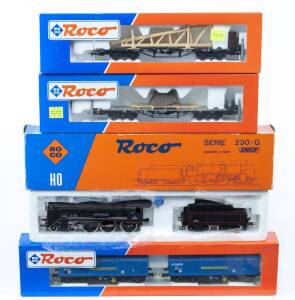 MODEL RAILWAYS: ROCO: SNCF Series 230-G Steam Locomotive with Tender (04125A) with Rolling Stock Comprising DB Two Telescopic Freight Car Set (44076), DB Heavy Duty Car Loaded with Diesel Engine (47223), KPEV Heavy Duty Car Loaded with Timber Frames (4718