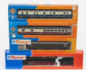 MODEL RAILWAYS: ROCO: DR BR 01 089 4-6-2 Steam Locomotive with Tender (43317), with Rolling Stock Comprising of DR 1st, 2nd and 3rd Class Passenger Car (44532), DB Dining Car (4272A), DBP Passenger Car (4262). All mint in original cardboard packaging. (4 