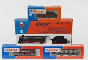 MODEL RAILWAYS: ROCO: DB BR 44 188-1 Steam Locomotive with Tender (04126B), with Rolling Stock Comprising of DB Self-unloading Freight Car loaded with Gravel (46239), OBB Open Freight Car (34520), DB Large Silo Car (46538). All mint in original cardboard 