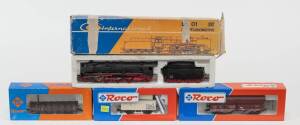 MODEL RAILWAYS: ROCO: DB BR 01 111 EP II Steam Locomotive with Tender (04119A), with Rolling Stock Comprising of DR Self-unloading Freight Car loaded with Coal (46242), K.S.Sts.E.B Covered Freight Car ‘Rama’ (47302), OBB Rungs Car (4306B). Most mint, all 