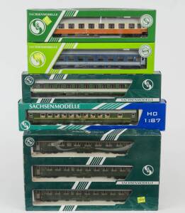 MODEL RAILWAYS: SACHSENMODELLE: Group of Passenger Rolling Stock Including of 3 piece BSL 1st & 2nd Class Passenger Car Set (14017), RZD Sleeping Car (74329), DR 2nd Class Ep.4 Passenger Car (14104). All mint in original cardboard packaging. (12 items)