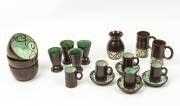 JUNE DYSON (1919-2004) A collection of brown and green glazed vessels and coffee cups and saucers