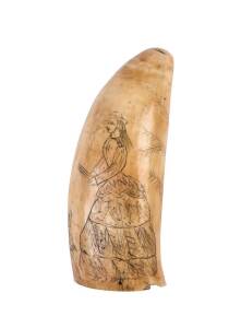 A scrimshaw whale's tooth with female portrait and tree