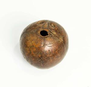 A scrimshaw coconut shell, circa 1820s