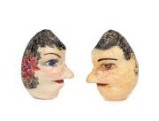 A pair of hand painted whale eardrums, late 19th century