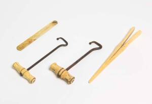 A pair of whalebone boot hooks, glove stretcher and implement, 19th century 