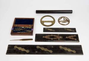 A selection of draftsman's tools including three ebony parallel rules, boxed implements, compasses etc, 19th century