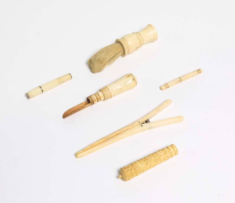 Four whalebone needle cases, shaving brush and glove stretcher, 19th century