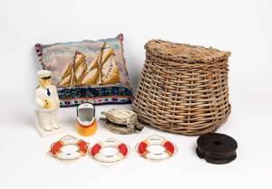 A fishing creel, two pulley blocks, ashtray, decanter, three souvenir life buoys and embroidered cushion