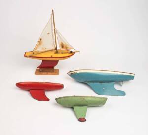 A group of four model pond yachts with painted hulls, mid 20th century