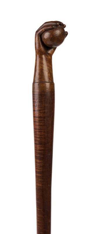 A fiddleback blackwood walking stick with Tasmanian musk carved fist and ball handle, 19th century