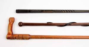 A group of three walking sticks, fiddleback blackwood with carved snake, New Zealand Maori carved stick and Indian ebony carved stick, 19th and 20th century