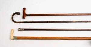 A group of four assorted walking sticks with silver collars, one with whalebone handle, 19th century