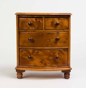 A Tasmanian huon pine apprentice chest with blackwood knobs and feet