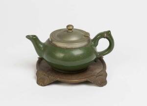 A rare ceramic Robur teapot with original pressed metal trivet, early 20th century