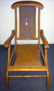 Antique folding easy chair with hand caned rattan seat and back. VG condition.