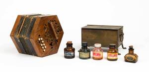 A folk art metal box embossed "Canberra"; together with five ink bottles and a squeezebox, circa 1930