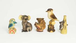 Two koala money boxes, ceramic koala decanter and two painted plaster kookaburras, early to mid 20th century