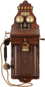 L.M.ERICSSON CO. Vintage wall phone. Sloped front timber and metal case, crank handle and twin bell. Good condition.