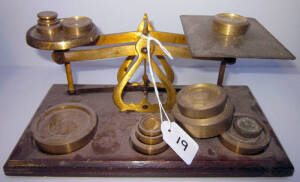 Antique English brass scales and weights on wooden base, and "Mack", cast iron scales. Fair condition.