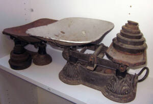 Antique cast iron scales (2) with weights. Fair condition.