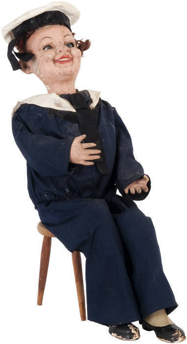 AUTOMATON: Antique clockwork seated Sailor with rocking head and moving eyes; original cotton cloth uniform and hat; papier mache head and limbs with hand painted finish. Mechanism in good working order with key, needing some restoration to the appearance