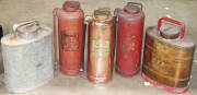 Vintage Fire extinguishers, one polished copper and brass and (2) with original red painted finish plus C.F.A Rega metal spray packs (2). Good condition.