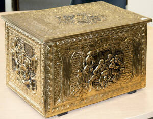 Vintage fuel box. Embossed brass box adorned with scenes of country life on four sides. 45 x 29 29cm. VG condition.