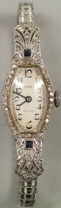 WATCH: Rolex ladies dress watch, circa 1920's, in white gold with diamonds and sapphires. Cased, in working order.