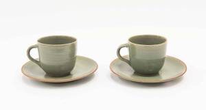 HAROLD HUGHAN Pair of celadon glazed teacups and saucers