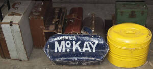 Bookies bag "John L. McKay", and assorted old suit cases, painted metal hat tin and gladstone bag. Mixed condition.