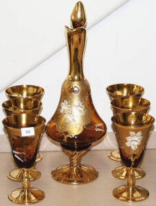 VENETIAN GLASS drink set comprising a ewer and 6 wine goblets. Amber glass with gilt and floral enamel overlay. VG