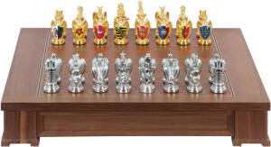 FRANKLIN MINT, "The Royal Houses of Britain Heraldic Chess Set". Gold and silver plated pewter pieces bearing crests. Inlaid wooden games board with 2 drawers felt lined with individual compartments to house pieces. Limited edition of 2500 set were made i