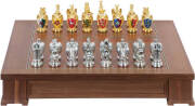 FRANKLIN MINT, "The Royal Houses of Britain Heraldic Chess Set". Gold and silver plated pewter pieces bearing crests. Inlaid wooden games board with 2 drawers felt lined with individual compartments to house pieces. Limited edition of 2500 set were made i