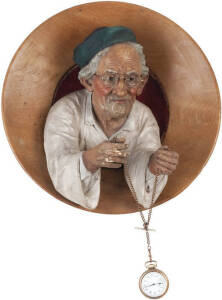 THE WATCHMAKER, attractive late Victorian clay fired sculpture of an elderly man (who can hold a pocket watch on a chain). Appears to have been used as a shop display for a jeweller/watch repairer. Mounted in a circular wooden dish measuring 38cm in diame